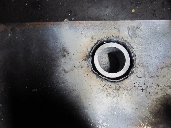 Torch out the hole, and grind away the slag.