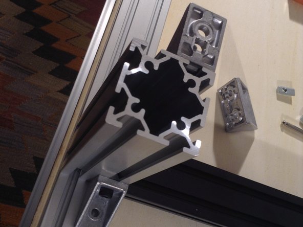 Build middle vertical column, front, use 2 brackets.