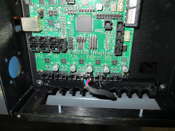 Route Z left motor wire through relief position #5.