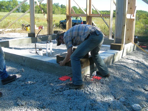 NEED TO TAKE PHOTO OF PLACING MASON'S BLOCKS, along with close-up of how they are used, how the string relates to the CEB wall, and how to sight along them.