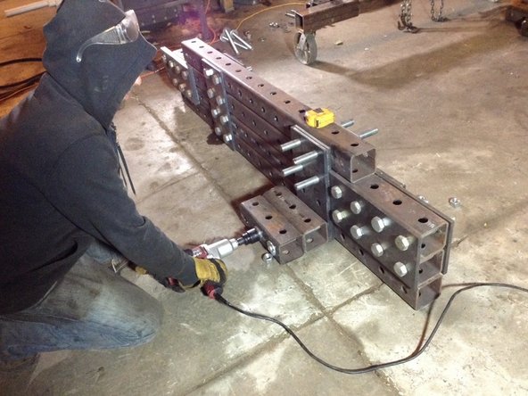 Tighten all nuts and bolts except for the 4 that go through the pivot plates.