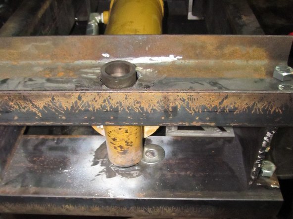 With the pin held in, tack the tubing on the top in place.