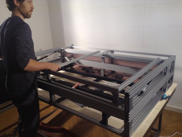 Place door on top of the gantry frame.