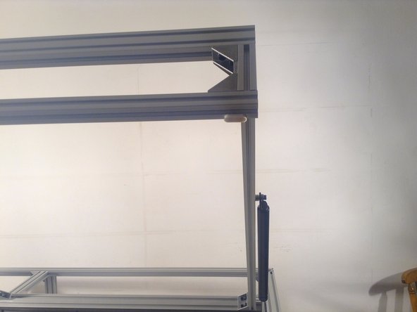 Glue sponge shock absorbers on the underside of the door.