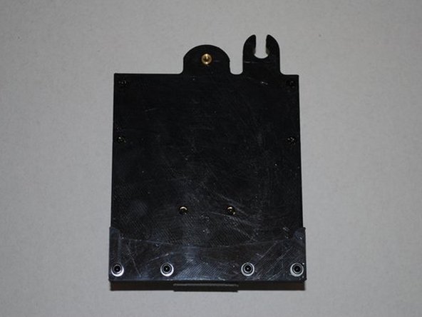 Using 4x M3 x 12 SHCS and M3 Washers. Install the X carriage guide as shown.