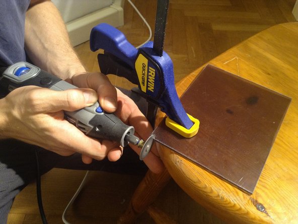 Peel the protective covering from the small panel, and insert.