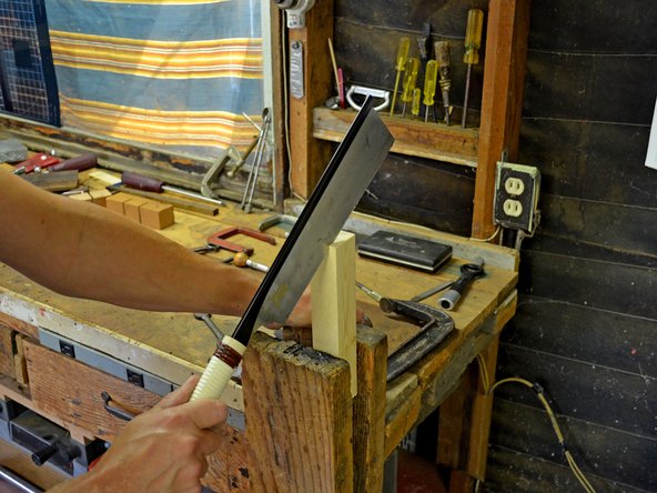 Begin your cut by placing the bottom edge of the saw on the corner edge of the workpiece. Make sure the saw blade lines up with any markings you made on the workpiece for this cut.