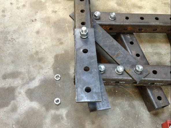 Next attach a 2x2 hole plate to the 4th and 5th holes of the stabilizer legs.