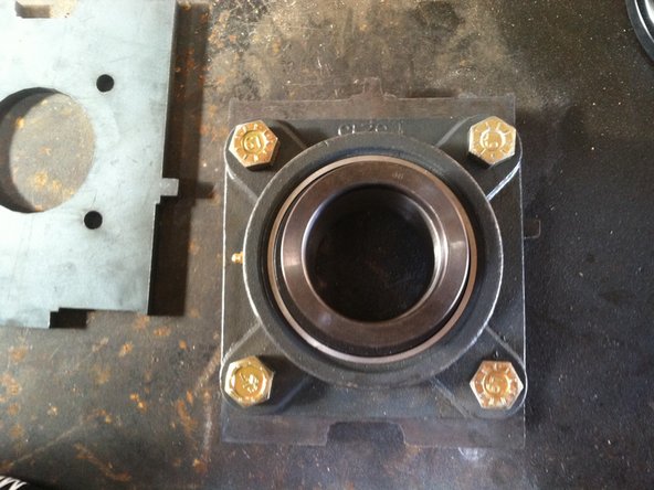Attach bearing to "middle plate" (insert part number) as shown in image.