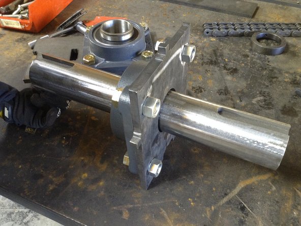 Feed shaft through bearings and lock colars