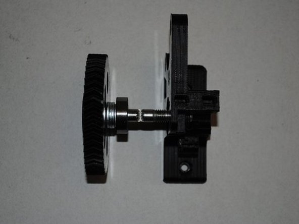 INSTALL GEAR, BOLT AND FIRST BEARING