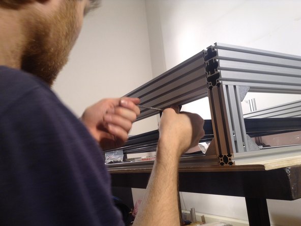 Insert rubber gasket in the bottom window edge. Poke in with the blunt end of a pen or some other object that helps the rubber to be pushed in the groove to create a tight seal.