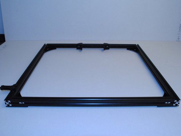 There is a tapped extension at the top of both the right and left extrusions.