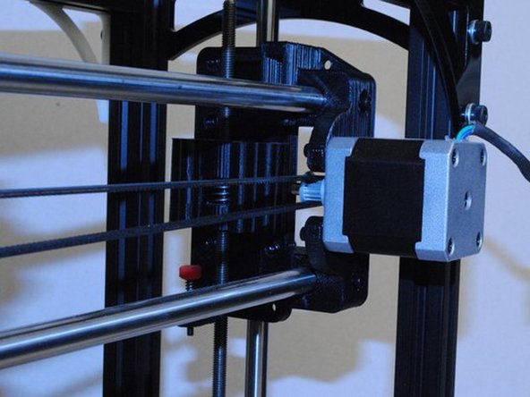 Route one end through the X carriage as shown and clamp down with a M3 x 12 SHCS and M3 Washer.