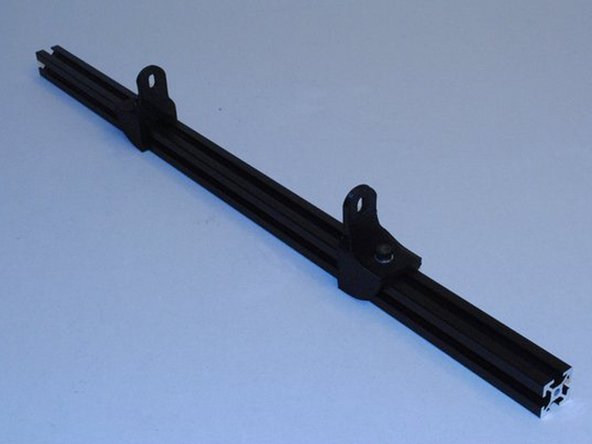 Install two Y mount chassis onto Extrusion with no taps using M5 x 10 SHCS, M5 Washers and M5 T-nuts.