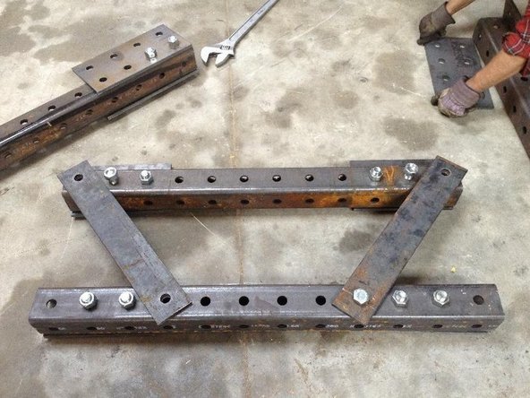 Install the 2 Angled Supports using 7 inch bolts, one on each side.  (as pictured)