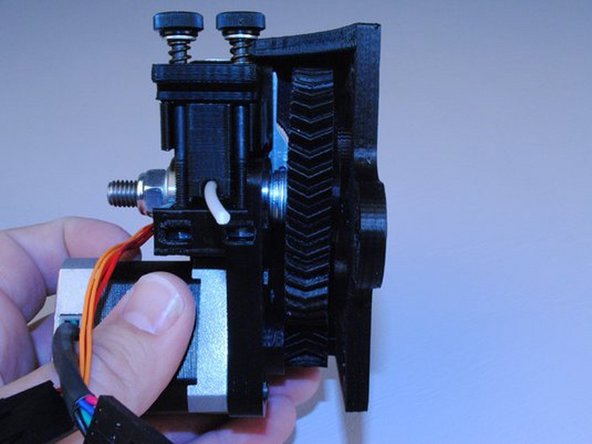 Using 2x M4 x 20 SHCS and M4 washers, assemble the Budaschnozzle, extruder and extruder mount together.