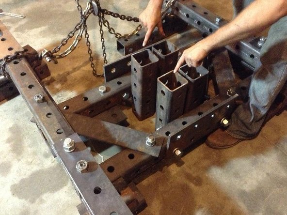 Attach Main Pivot Tubes to Quick Attach tubes. Leave a space of 4&quot; between them. Use ~10&quot; bolts to attach Reinforcement plates to the Main Pivot Tubes (through Quick Attach tubes)
