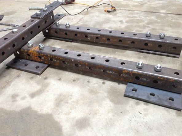 Mount two 4x1 hole plates to end of 12-hole tube to create vertical support for Stabilizer Legs.   (RobK note - check length)