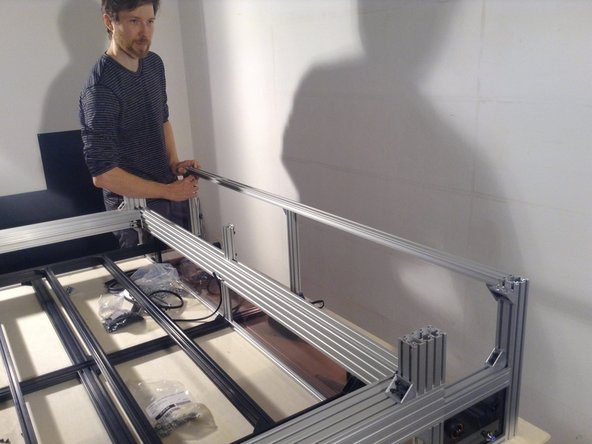 Mount rear horizontal, 2040 extrusion with 2 double brackets, and then mount the midpoint with a single bracket.