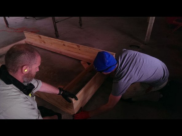 The long edge will be flush with the front of the frame, and the short sides will be flush the long plywood sides.