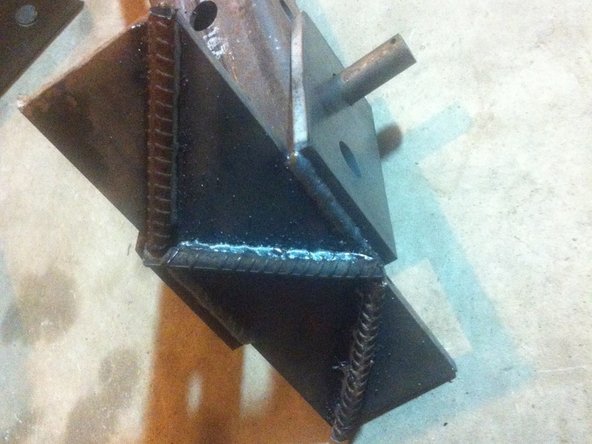 Weld feet to feet pivot plates (we used a stack of spacers to get the feet in the right position before tacking and welding).