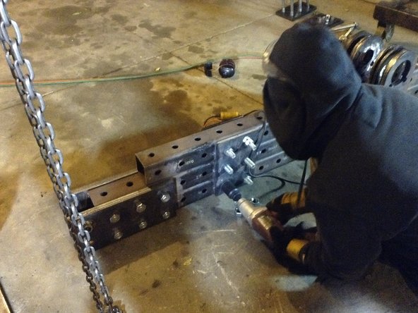 Tighten all nuts and bolts except for the 4 that go through the pivot plates.