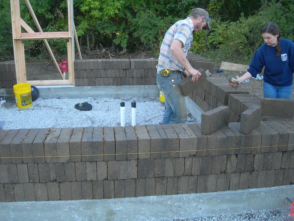 Image 3: Check each row for straightness using the mason's string and make any adjustments before moving on to start the next row. Also double check your sides and diagonals.