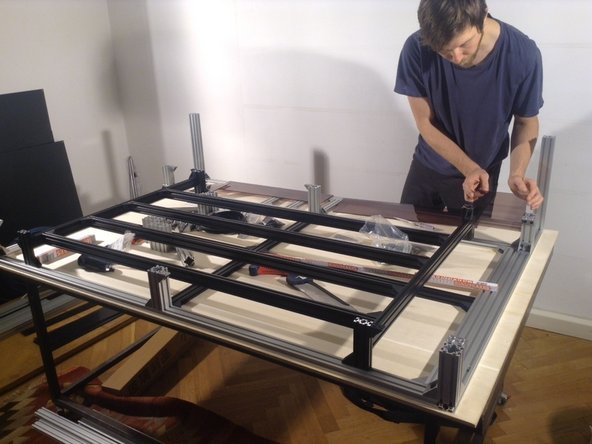 Take out the panels, insert the table frame.