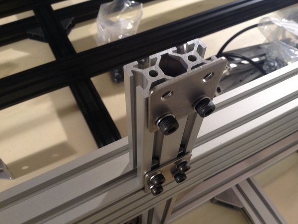 Mount top flat bracket on top of middle rear surrport above the gantry frame.