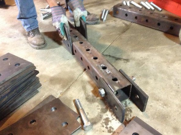 Attach bottom cylinder mounts to legs