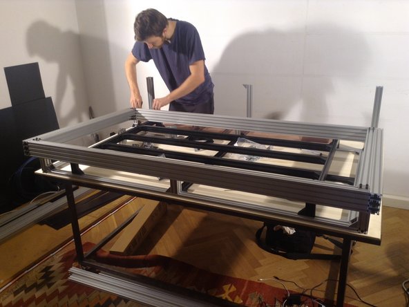 Place the gantry frame on top of the table.