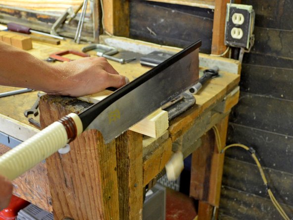 Keep cutting into the workpiece until the notch is created.