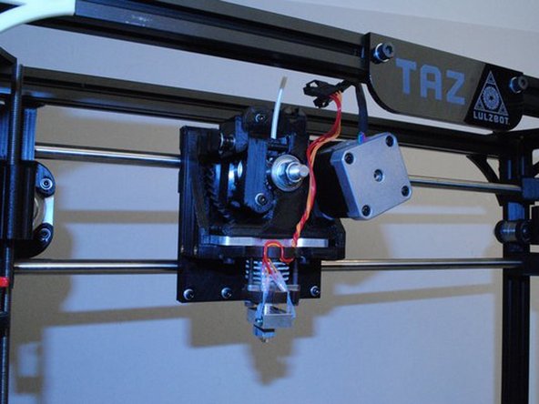 Take the print head assembly and seat the bottom of it down into the X carriage assembly.