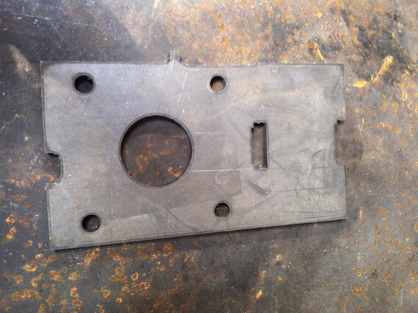 Be mindful of orientation of grease zerk relative to plate. Must remain accessible once unit is fully assembled.