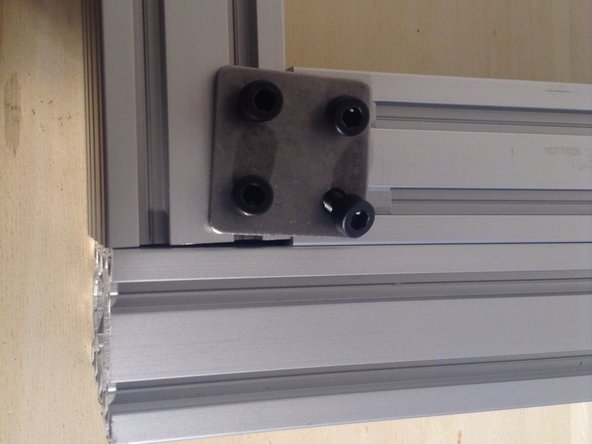 Use 4 screws, now 8 mm long. Start screws on all sides. Do not tighten yet.