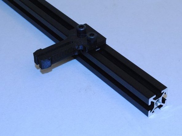 Slide 2x M5 T-nuts into the slot on the bottom right extrusion.