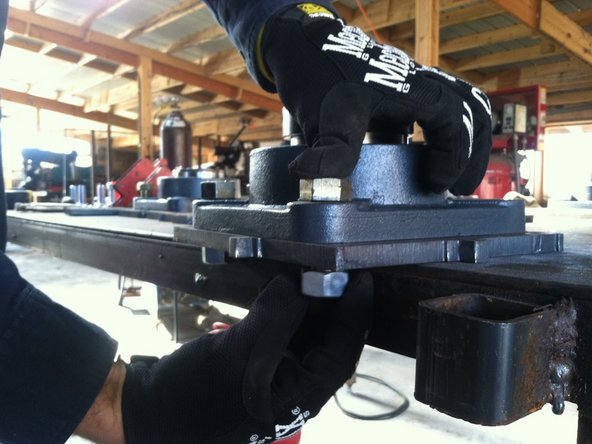 Be mindful of orientation of grease zerk relative to plate. Must remain accessible once unit is fully assembled.