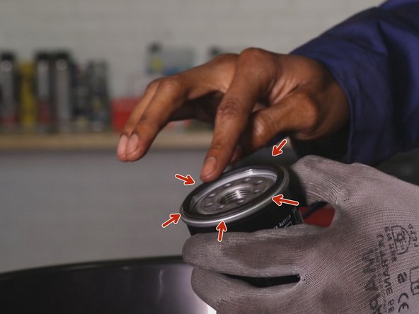 
Place some oil on your finger and lubricate all around the oil filter gasket
