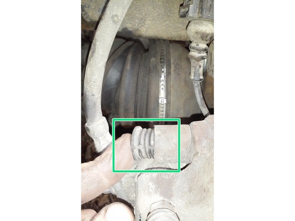 Repositionner les deux caches sur les têtes de vis en haut et en bas