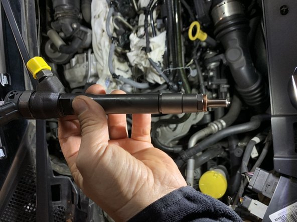 placer la bague d étanchéité sur le nouvel injecteur et remettre en place .