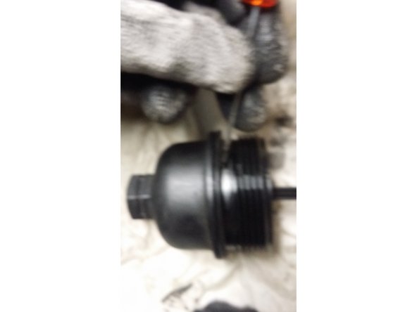 Remonter le filtre neuf en le glissant sur la tige