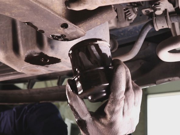 
Unscrew the oil filter by hand and remove the
