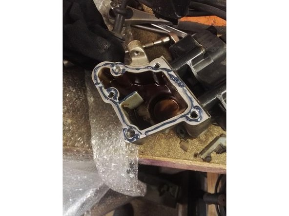 Mettre de la pate à joint sur le module d'allumage