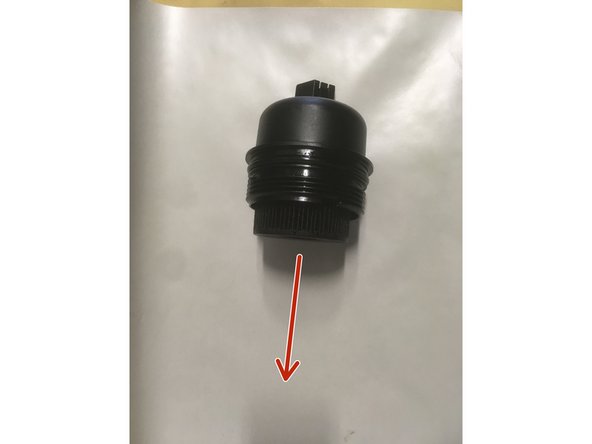 Retirer l'ancien filtre de la cloche en le tirant vers le bas