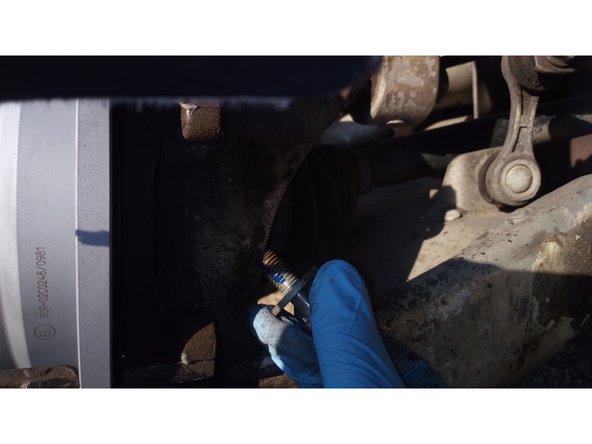 Remettre le support d'étrier en place en mettant du freinfilet sur les boulons