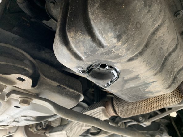 Remonter le bouchon de vidange avec le joint cuivre neuf