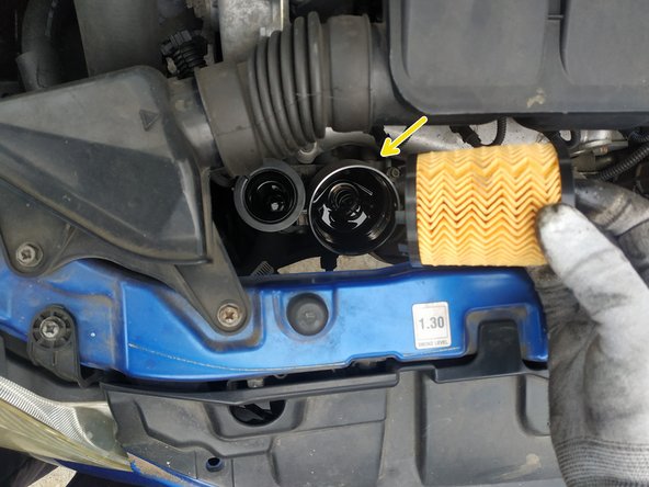 poser le filtre, le ressort du bas doit être en place