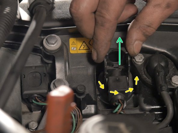 Pour retirer les bobines relever la languette pour la débrancher puis tourner la bobine tout en tirant vers le haut