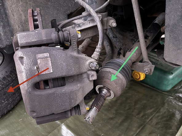 Afin de désolidariser la suspension du bras de suspension, dévisser et déposer les 3 vis de fixation de la rotule de suspension a l'aide d'une clé de 16 et d'une clé allen.